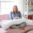Mom-to-be sitting with the Contours pregnancy pillow Thumbnail
