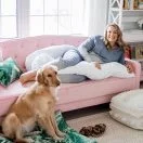 Mom-to-be lounging with the Contours pregnancy pillow Thumbnail