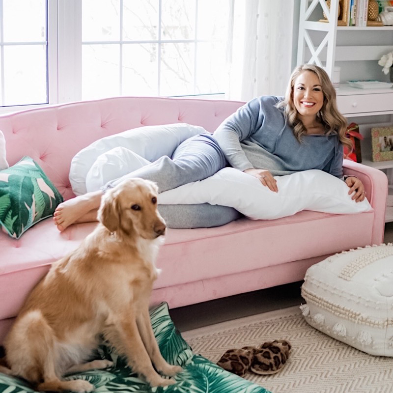 Mom-to-be lounging with the Contours pregnancy pillow