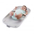 baby lying on back on changing pad Thumbnail